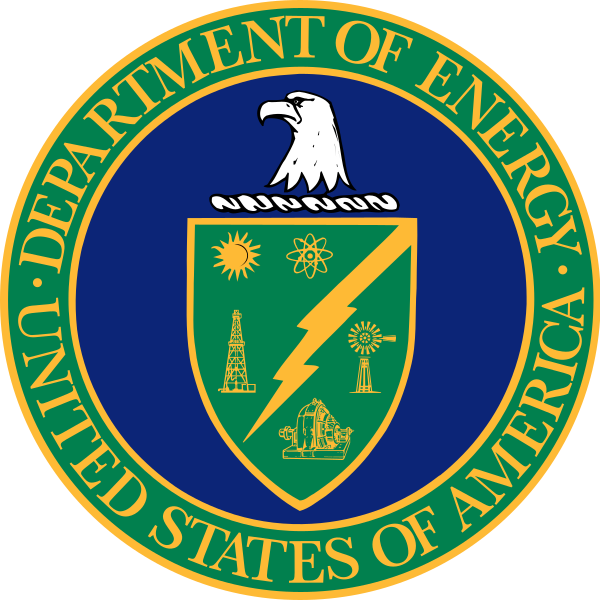 A circular seal representing the United States Department of Energy. The outer ring is deep blue with the words "Department of Energy" at the top and "United States of America" at the bottom. Inside the circle, there's a green shield. At the top of the shield is a white bald eagle's head facing left. The shield features four symbols: a radiant sun in the top left, a traditional oil derrick in the top right, a bolt of lightning diagonally from top left to bottom right, and a stylized atomic structure in the bottom left. The background of the shield is deep green, and it's surrounded by the blue circle of the seal.