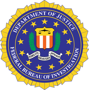 The image depicts the seal of the Federal Bureau of Investigation. The seal is a blue circle with a yellow border. The words ‘Justice’ and ‘Bureau of Investigation’ are written in gold around the border. The center of the seal is intentionally blurred for privacy.