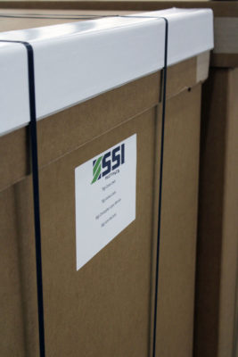 This is a photo of a cardboard box with a white label on it. The label features a green logo with the letters “SSI” and the text “Sustainable Solutions International” written below it.