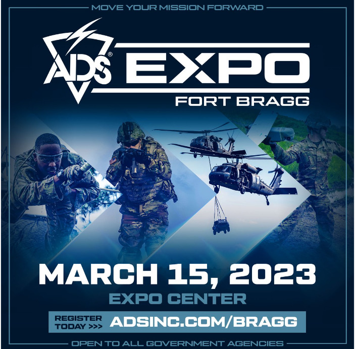 This is a poster for the ADS Expo Fort Bragg 2023 event. The poster has a blue background and features images of military personnel and equipment. The event, which is open to all government agencies, is scheduled to take place on March 15, 2023, at the EXPO Center. The poster prominently displays a large white ‘ADS’ logo at the top with ‘EXPO’ written in blue. There is also a white ‘REGISTER TODAY’ button at the bottom, indicating a link to the event website.